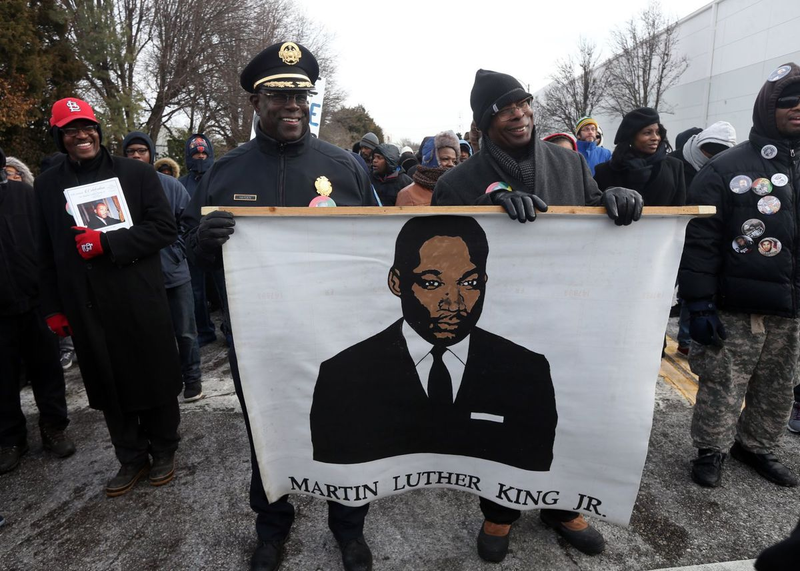 St. Louis Police Chief John Hayden and Director of Public Safety Jimmie Edwards carry a banner in the Martin Luther King Jr. parade on Monday down the city’s Dr. Martin Luther King Drive. (Laurie Skrivan/ St. Louis Post-Dispatch)
